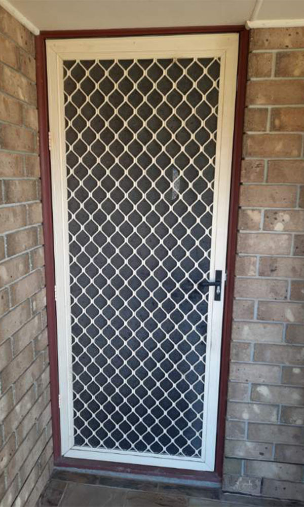 Cream diamond grill security doors with vision restricted mesh