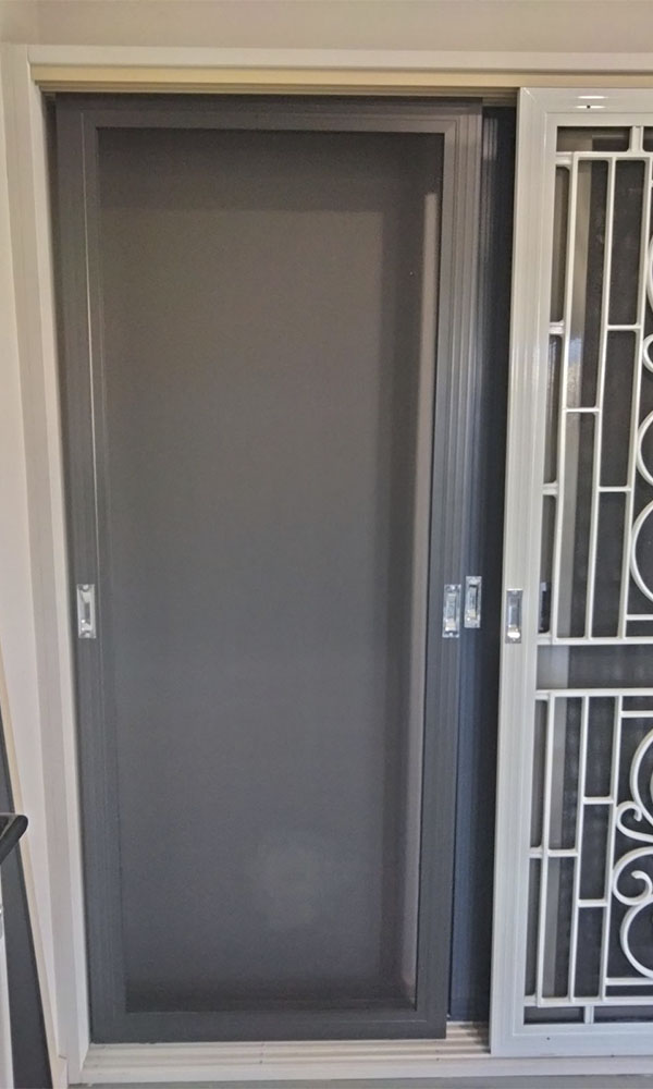 Grey aluminium security screen door with toughened mesh